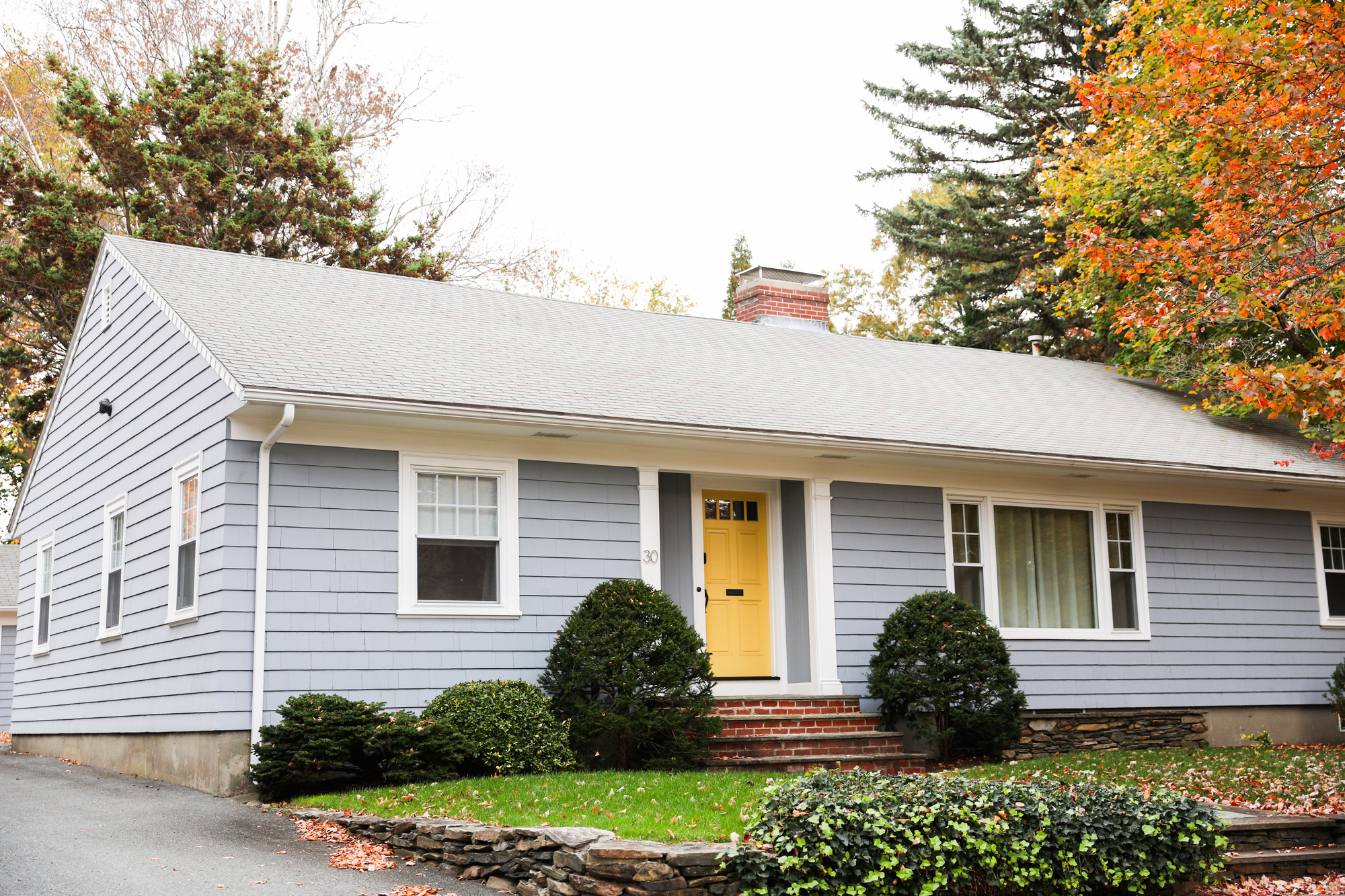 Light gray asphalt shingle roof on single-story home.
