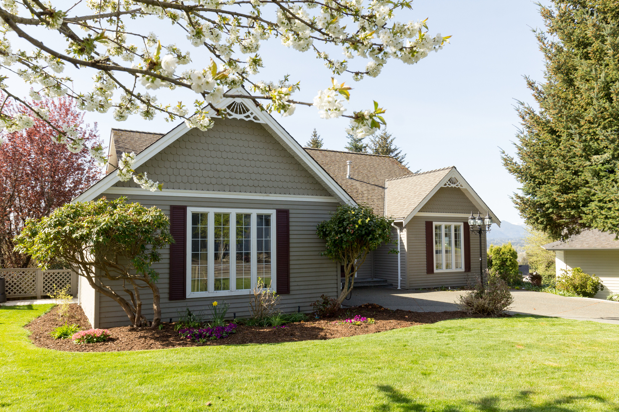 House with big windows and a shingle roof
